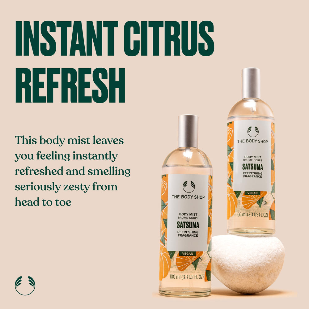 Close-up of satsuma fruit and mist bottle highlighting zesty, energizing scent