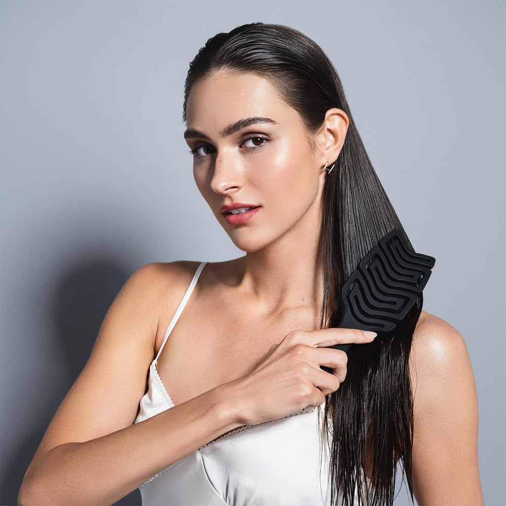 The Hair Edit detangle brush ergonomic paddle offers comfortable grip during styling.
