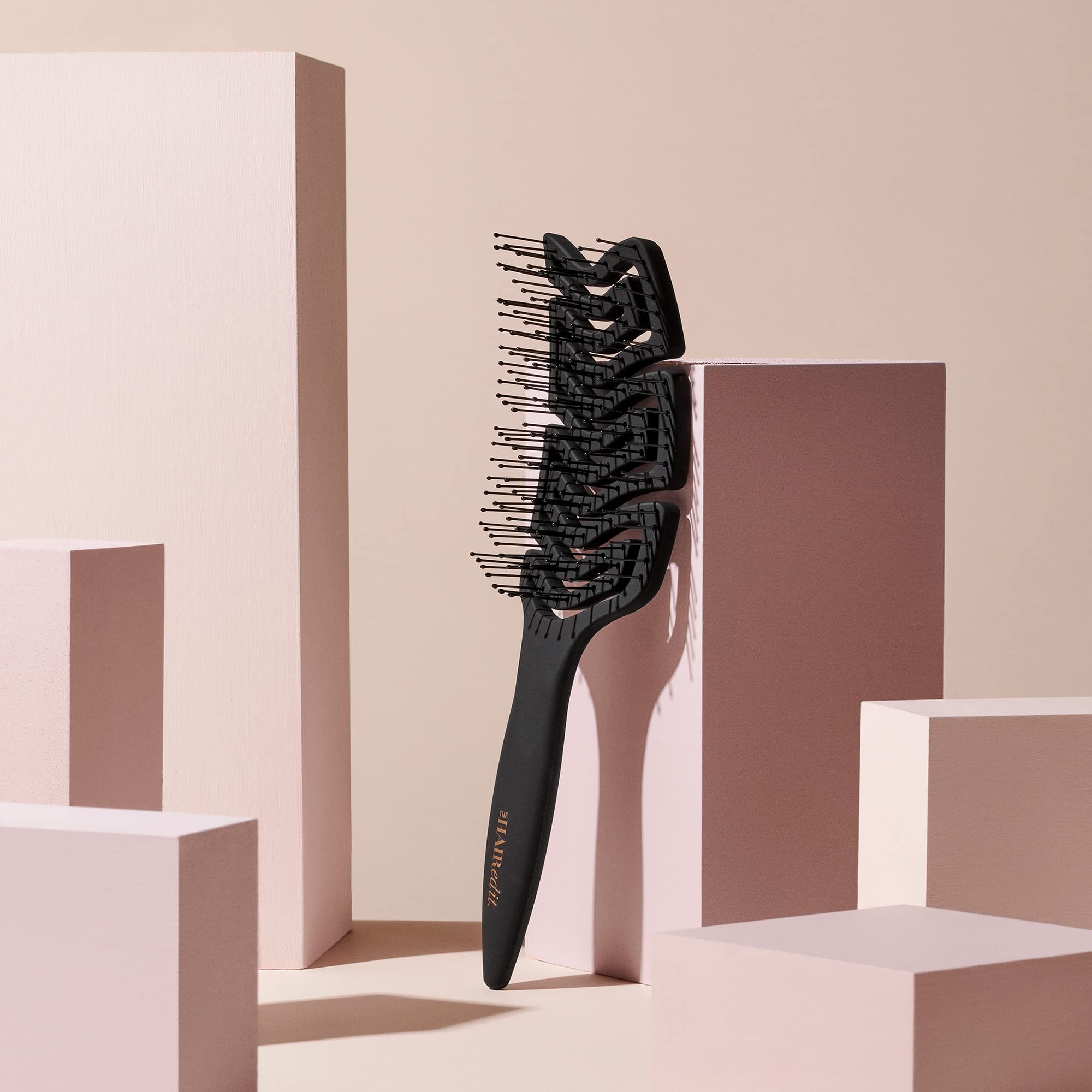 The Hair Edit detangle brush curved paddle delivers a soothing scalp massage.