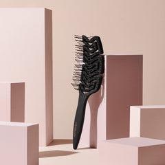 The Hair Edit detangle brush curved paddle delivers a soothing scalp massage.