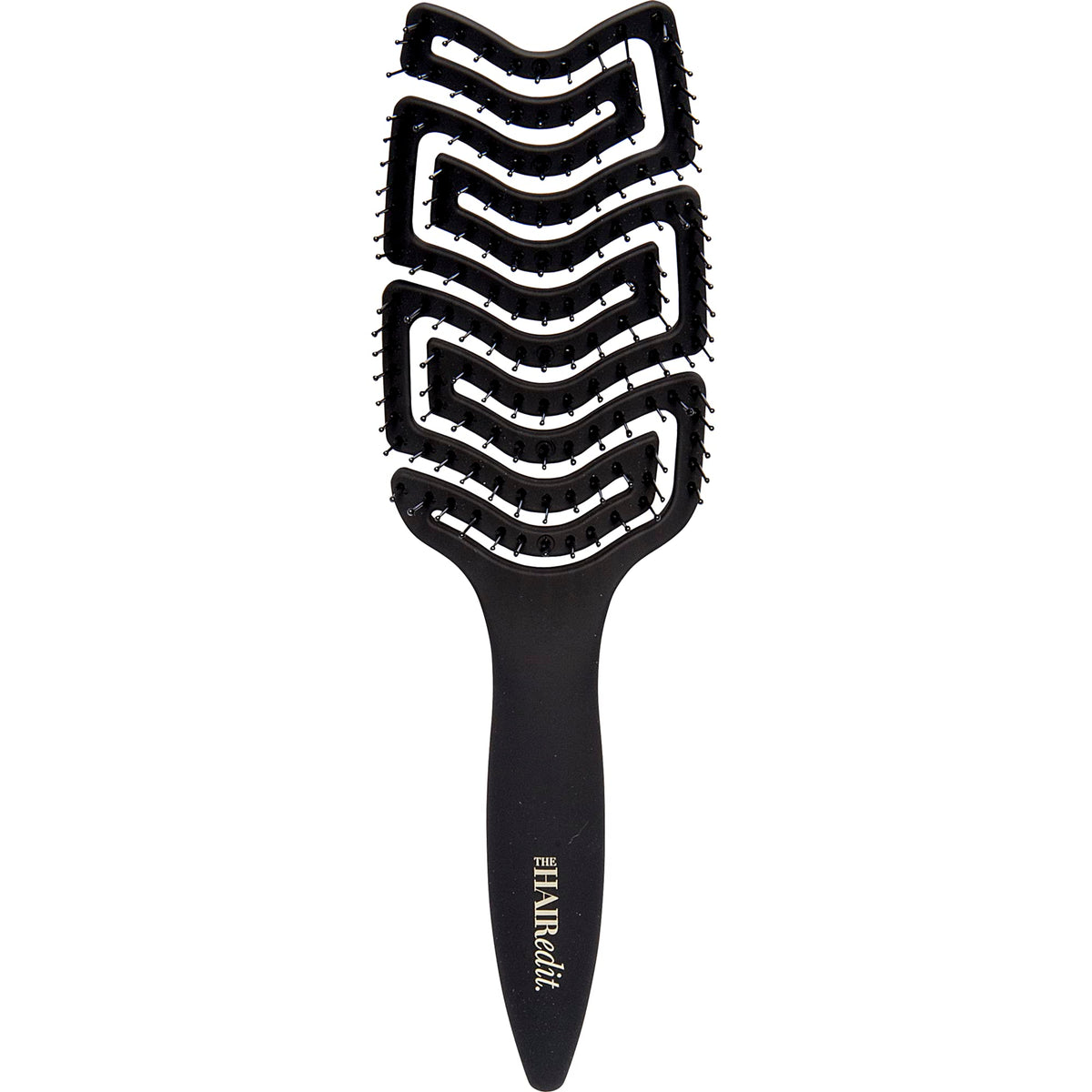 The Hair Edit detangle brush glides through wet hair for gentle detangling.