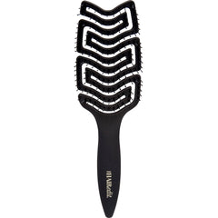 The Hair Edit detangle brush glides through wet hair for gentle detangling.