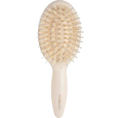 The Hair Edit mini brush close-up showing boar bristles for gentle detangling
