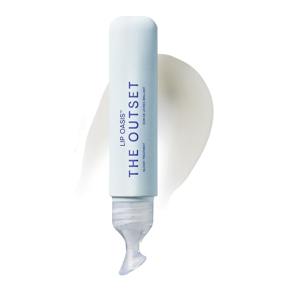 The Outset Lip Oasis lip balm tube open, ready to hydrate dry lips with a glassy finish.