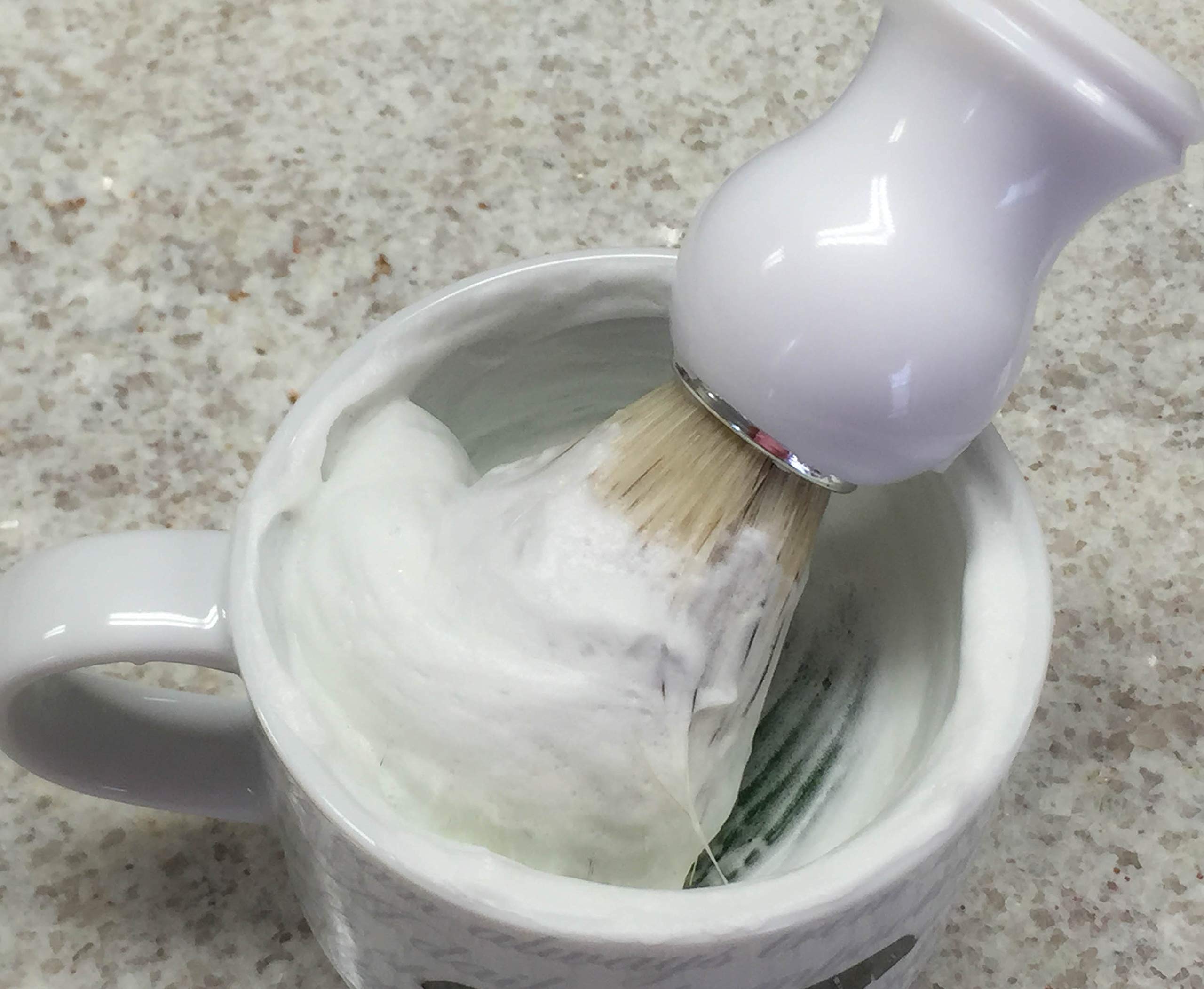 The Village Soapsmith Old Spice fragrance detail enhances the shaving ritual.