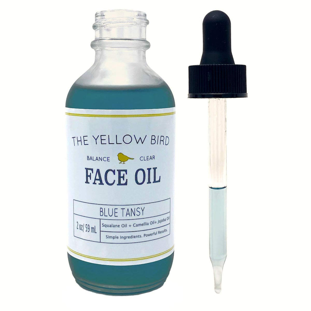 Application on the cheek shows quick absorption and dewy glow with The Yellow Bird oil.