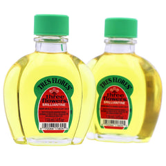 Three Flowers Brilliantine: botellas ámbar 2-pack para brillo suave y manejo.