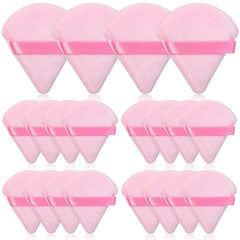 Thrilez pink triangle powder puff for precise powder placement on the face.