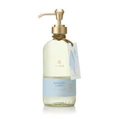 Thymes Hand Wash Washed Linen bottle with cedarwood and lavender notes.