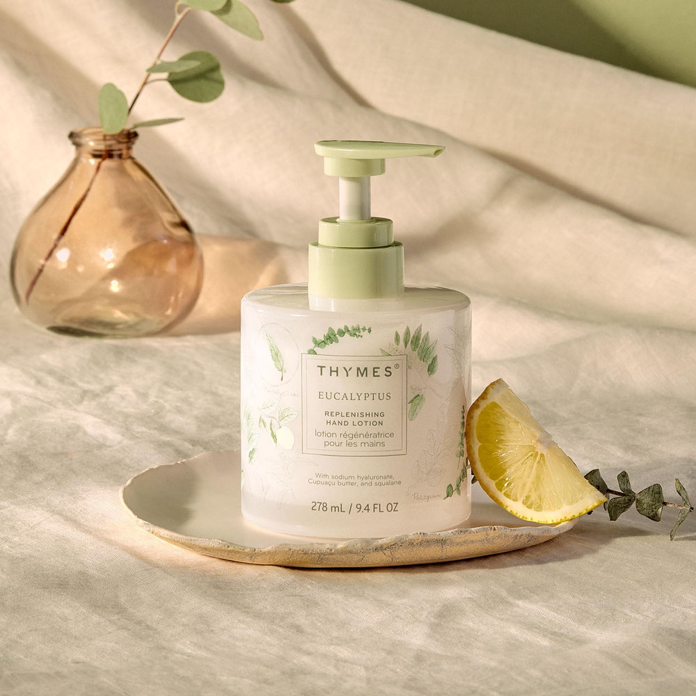 Thymes hand lotion in a glass vessel showcasing premium packaging.