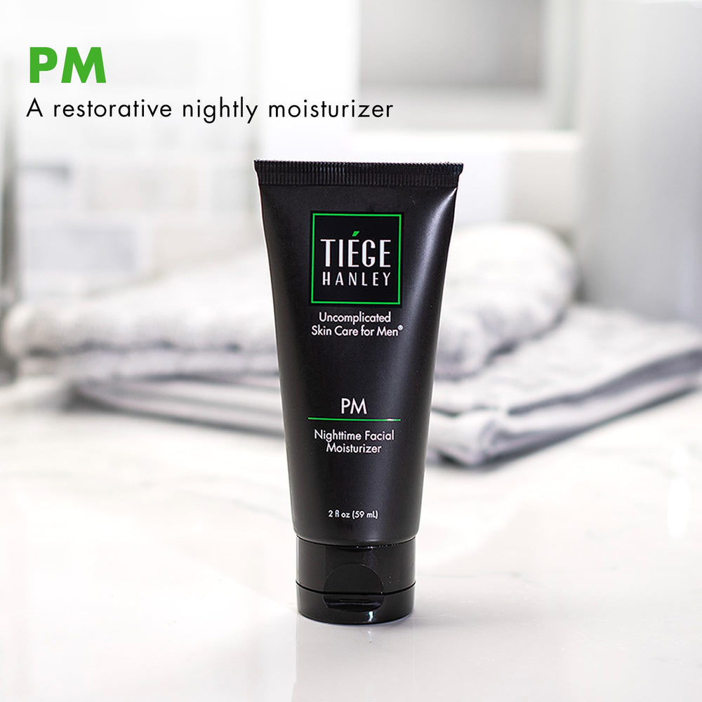 Tiege Hanley moisturizer being applied to the face for overnight nourishment.