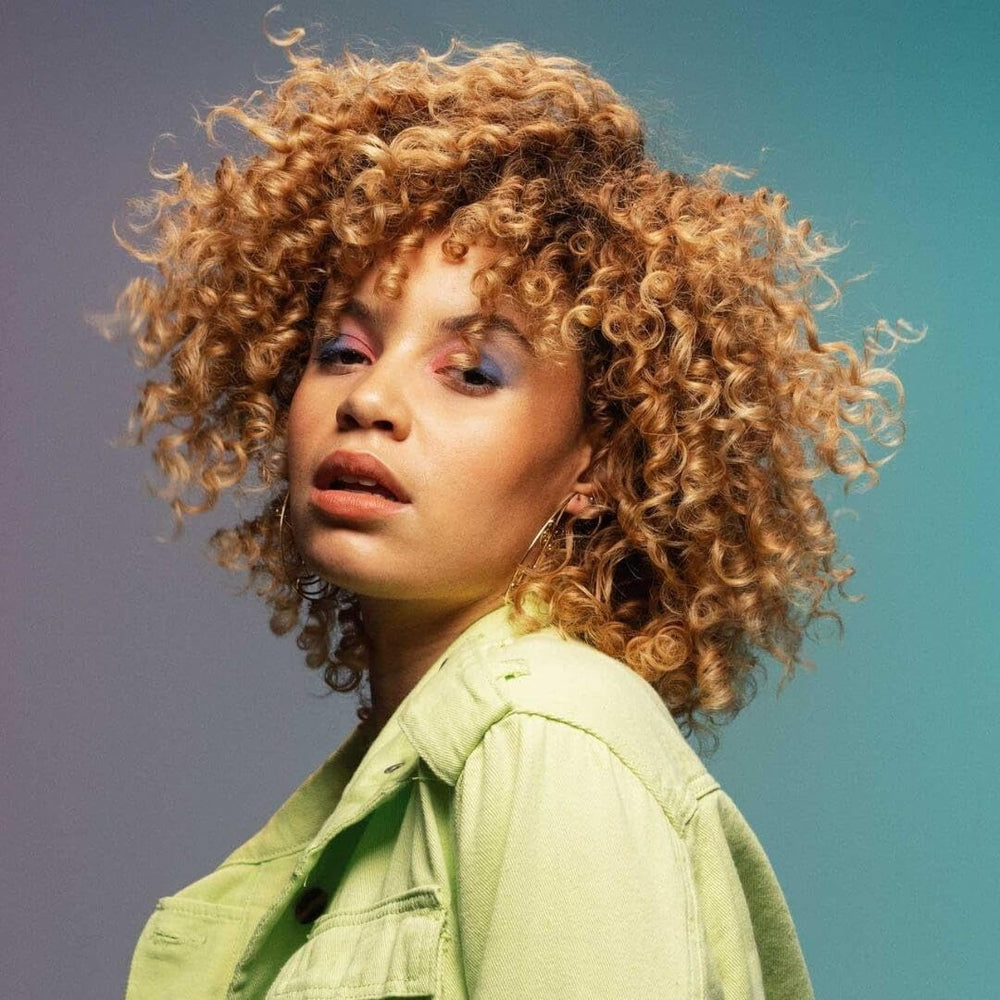 TIGI Bed Head Curls Rock Amplifier Curl Cream texture demonstrates long-lasting hold and softness.