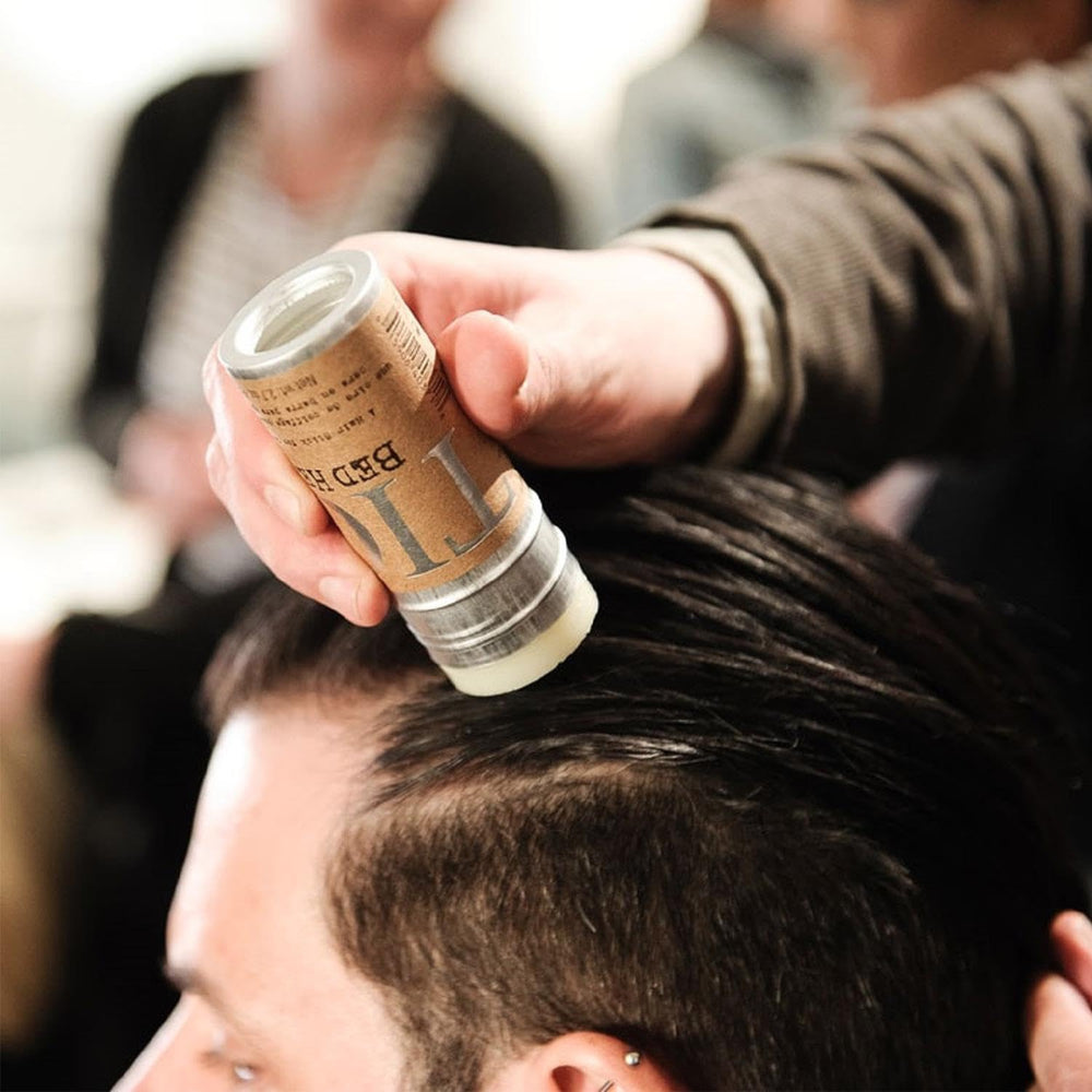 TIGI Bed Head wax stick semi-matte finish highlighting defined texture.