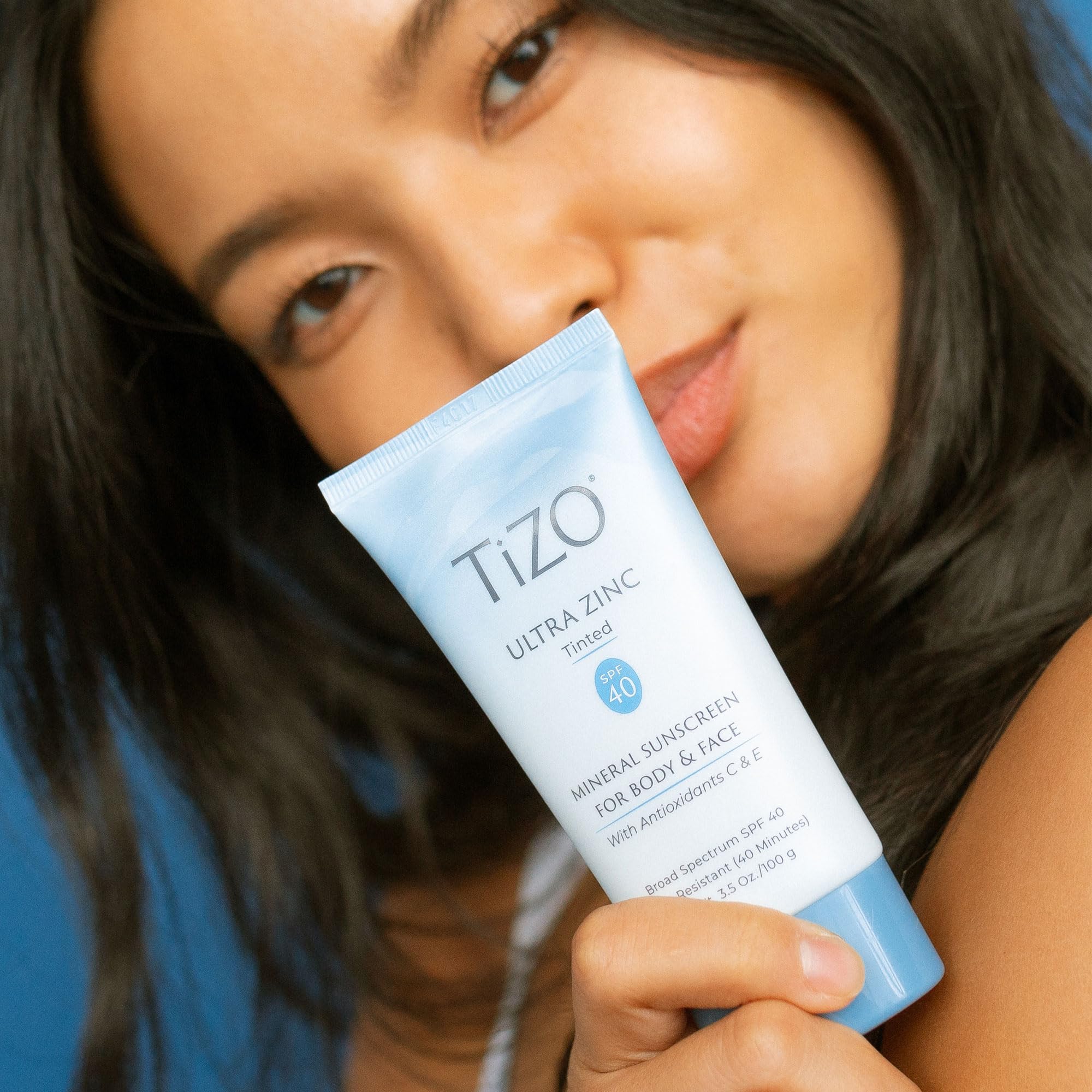 TIZO Ultra Zinc tinted sunscreen yields a dewy finish on the cheek