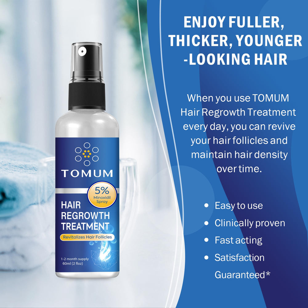 Tomum Minoxidil on damp hair aiding absorption and effectiveness.