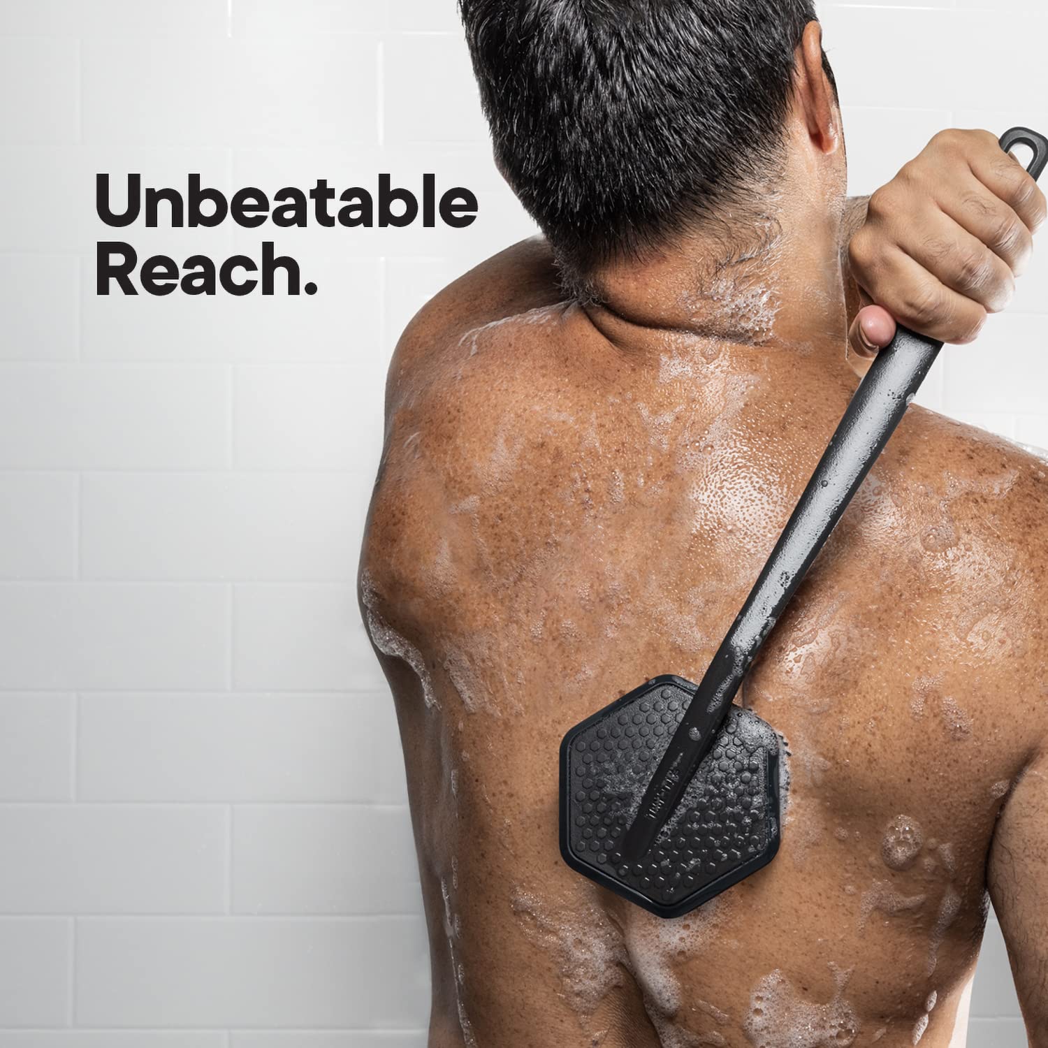 TOOLETRIES silicone back scrubber long handle in use on back.