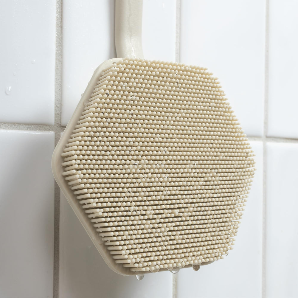 TOOLETRIES silicone hook stores securely on smooth surfaces in the shower.