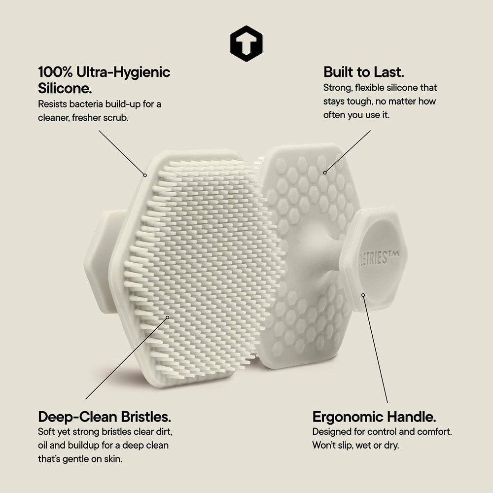 TOOLETRIES silicone face scrubber in shower demonstrates durable design for long-lasting cleansing.