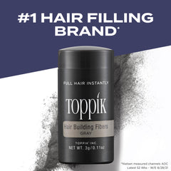 Close up of Toppik fibers blending with gray hair for natural thickness