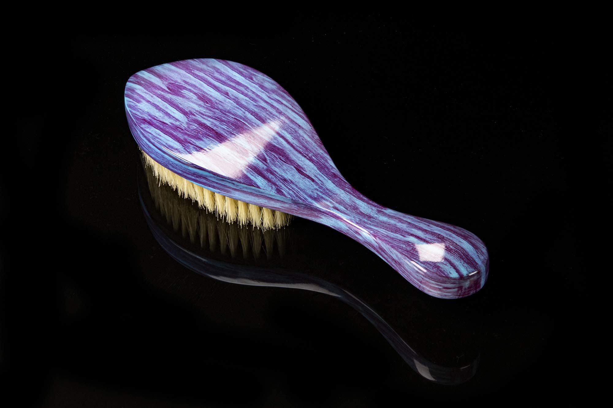 Torino Pro 60 Wave Brush in hand during brushing routine
