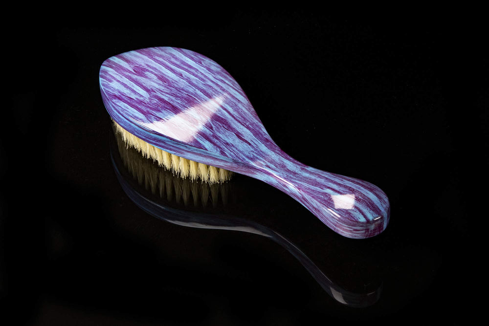 Torino Pro 60 Wave Brush in hand during brushing routine