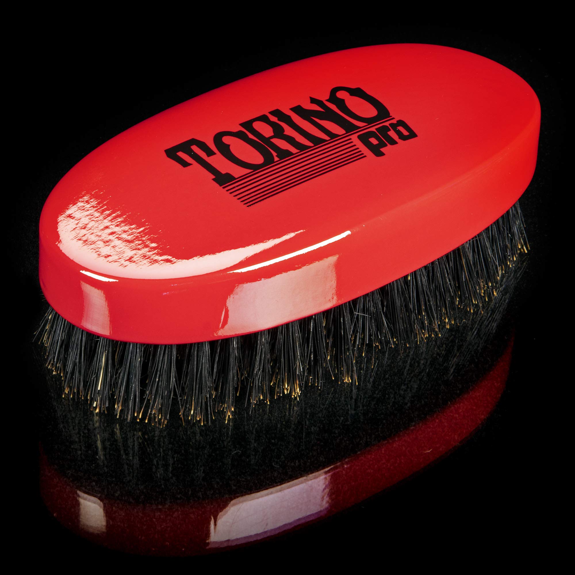 Torino Pro Wave Brush red bristles closeup for improved pull and lines.