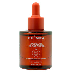 TOTEMICA Jojoba Oil Glow Elixir bottle shows lightweight hydration for radiant skin.