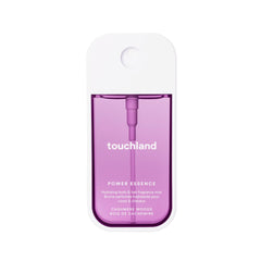 Touchland Cashmere Woods bottle front for on-the-go fragrance.