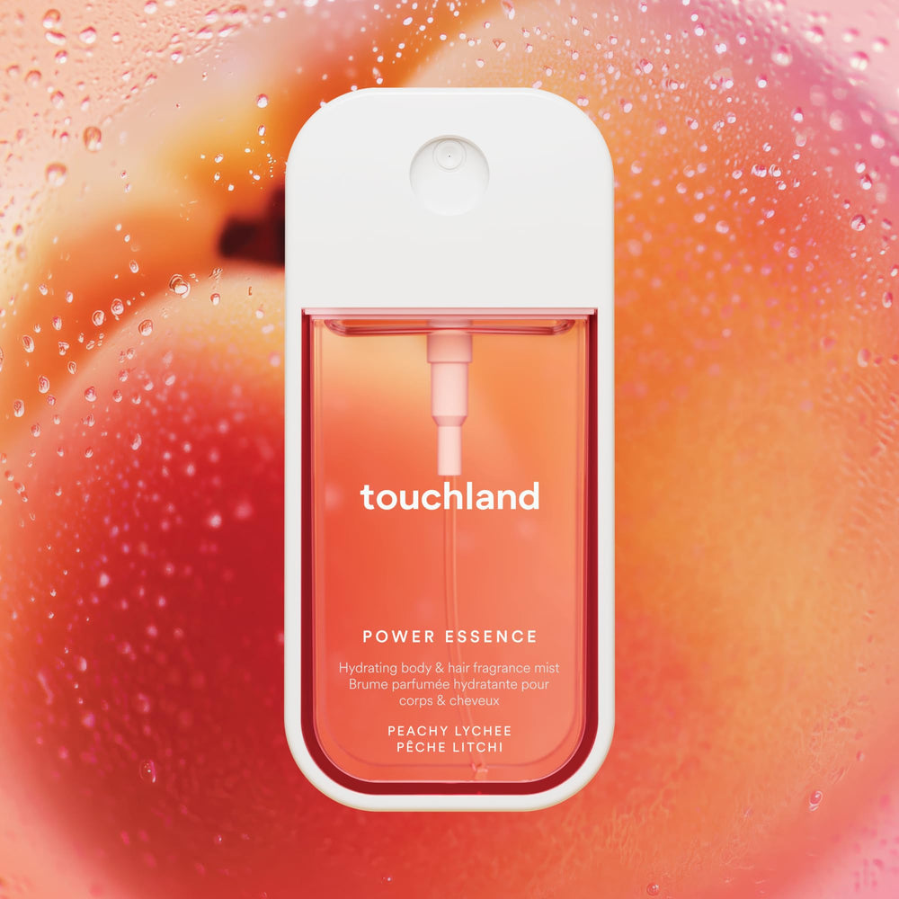 Touchland mist being applied to hair and body with a light, hydrating feel.