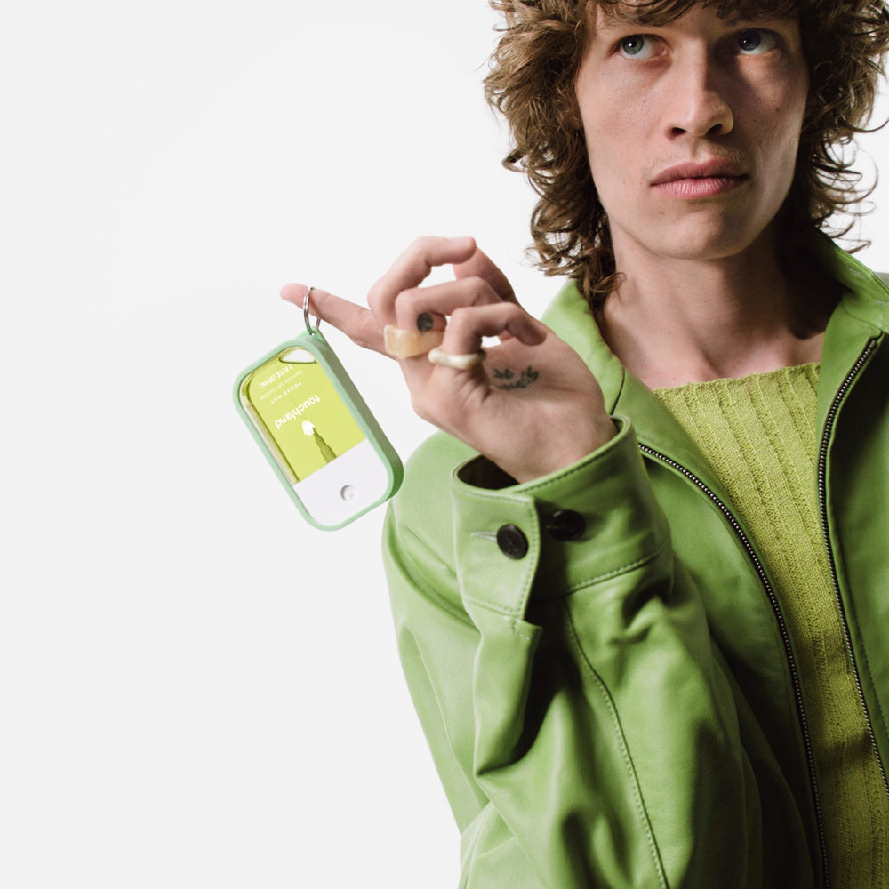 Touchland hand mist case with keyring for quick access on keys or bag.