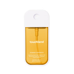 Touchland Mango Mojo bottle pour shows quick, refreshing spritz for skin and hair.