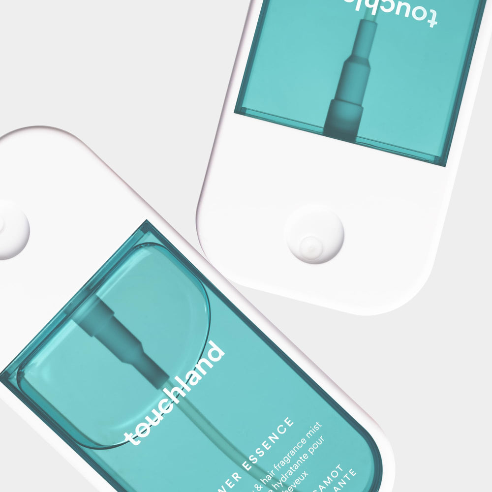 Touchland skincare-infused formula with hyaluronic acid and niacinamide for moisture.