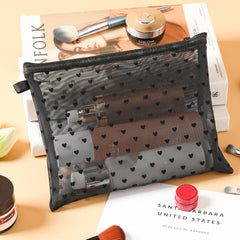 TRAKWAN mesh bag with zipper closure in black for secure access.