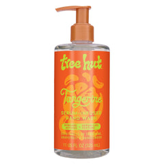 Tree Hut Tangerine Serum-Infused Hand Wash bottle on sink, nourishes skin with citrus-infused care.