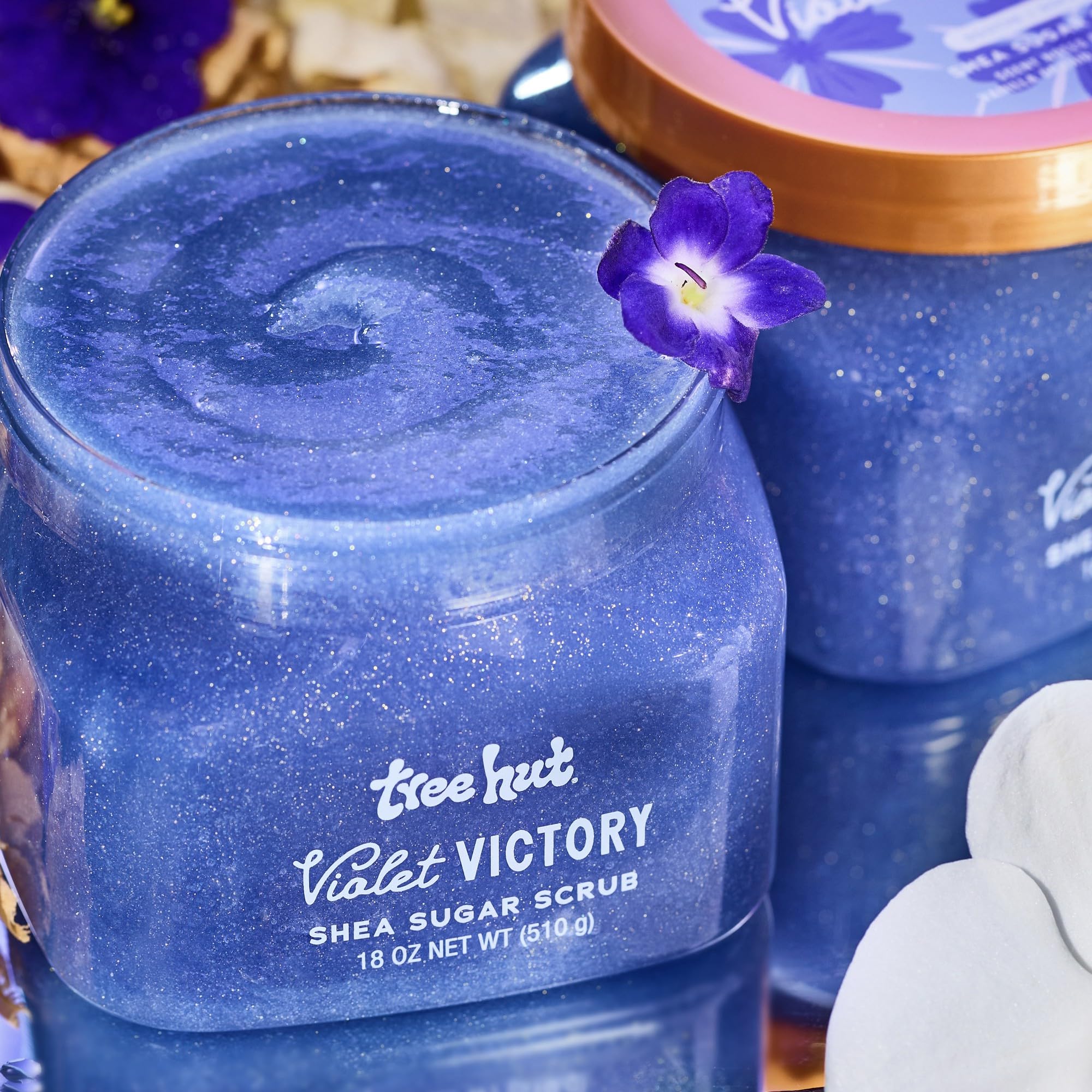 Tree Hut Violet Victory shown in shower setup with exfoliating texture