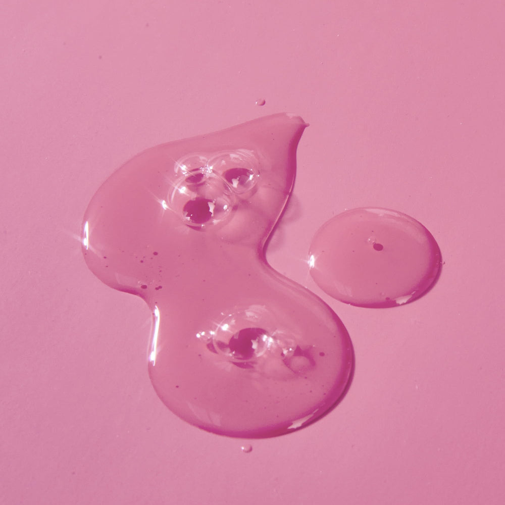 Applying Tree Hut Moroccan Rose serum on skin after shaving for calm, smooth feel.