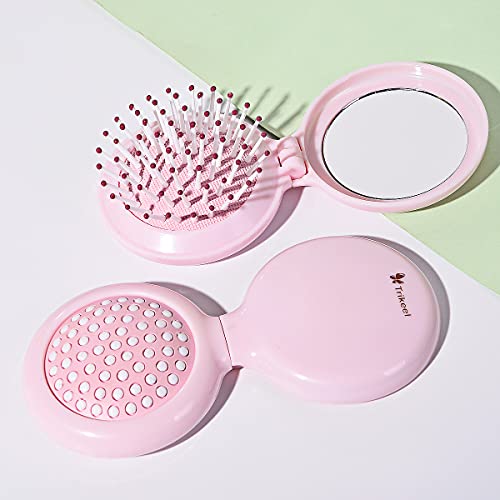 Trikeel brush pops up for quick detangling and compact storage