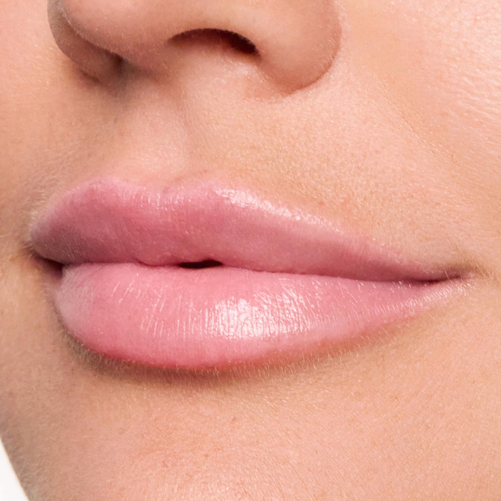 Trish McEvoy Easy Lip Color Dolled Up deep shade applied with brush for precise color.