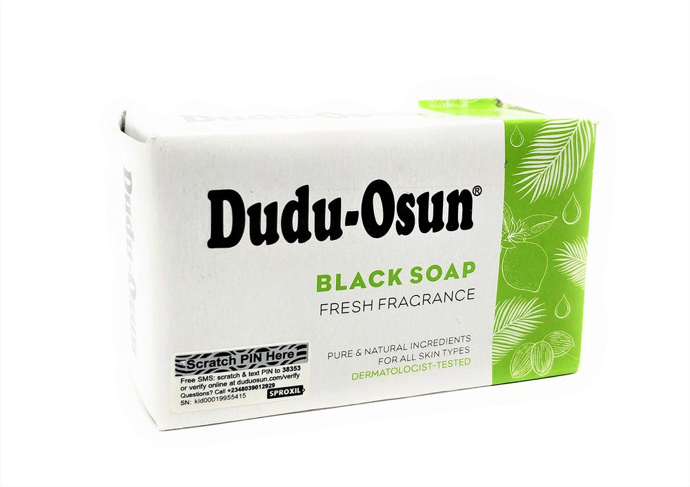 Tropical Naturals Dudu Osun black soap bar close-up showing natural texture and ingredients.
