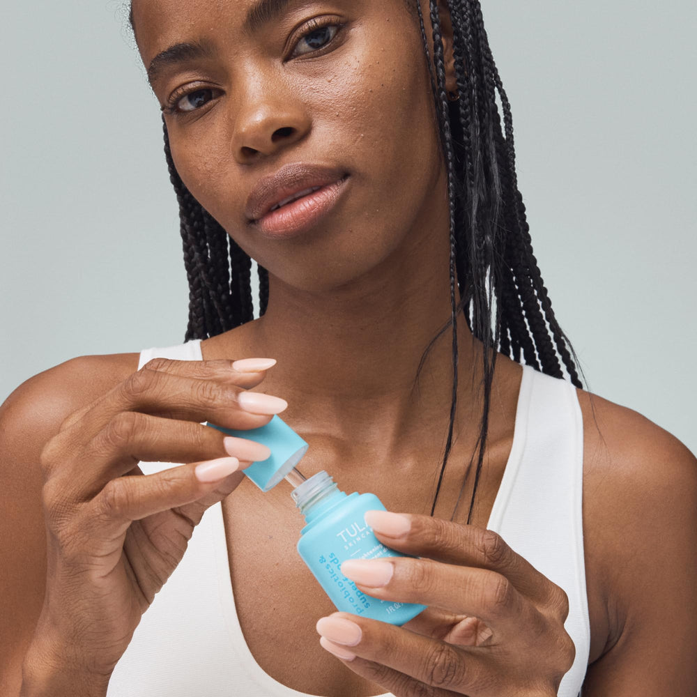 TULA Brightening Drops serum texture close-up showing light formula