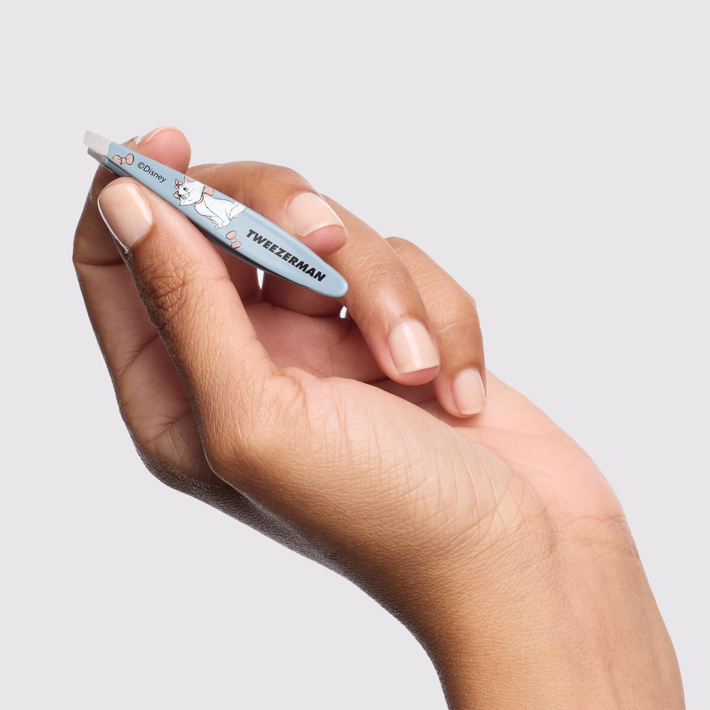 Tweezerman Aristocats mini slant tweezer travel case ready for on-the-go grooming.