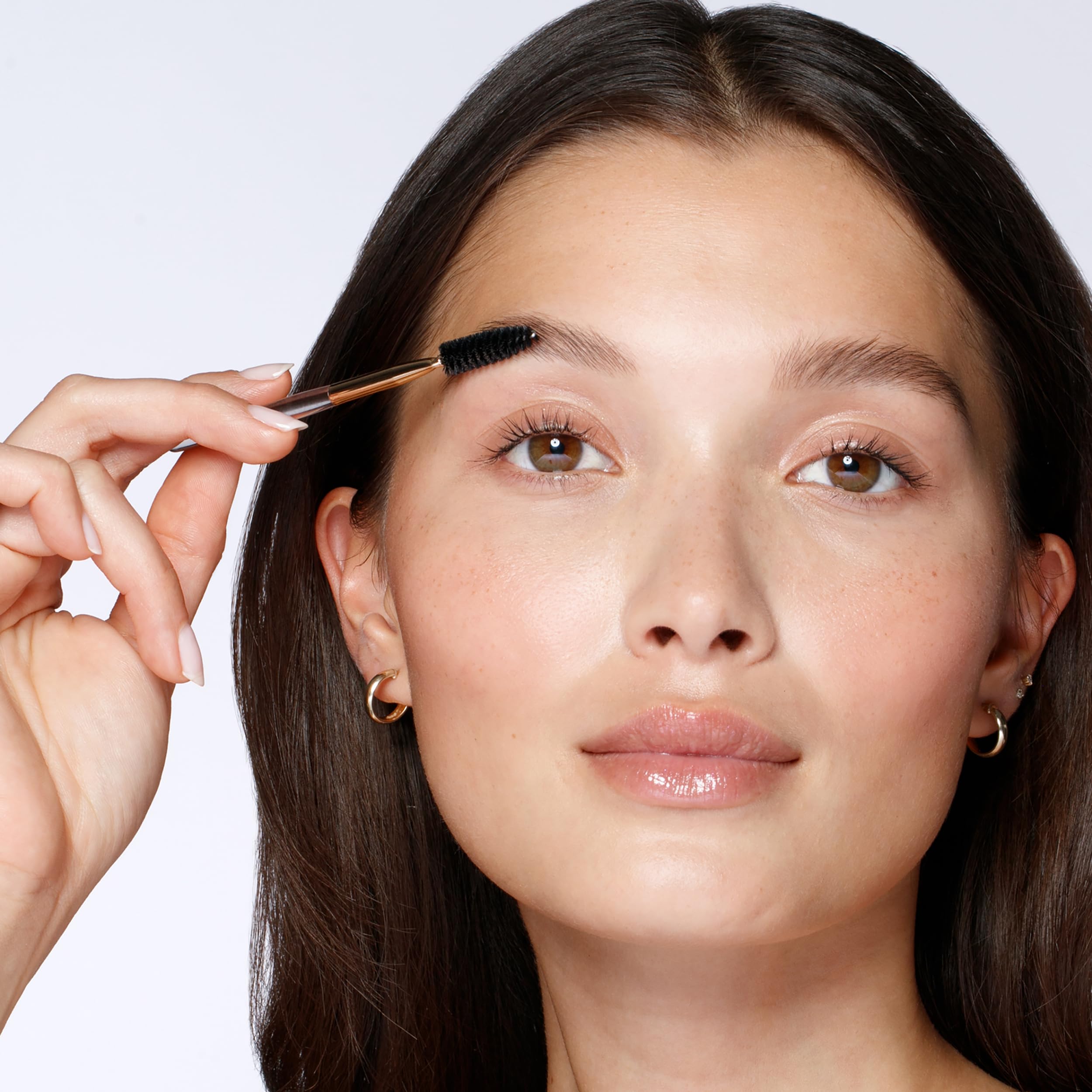 Tweezerman brow shaping brush included for a natural finish