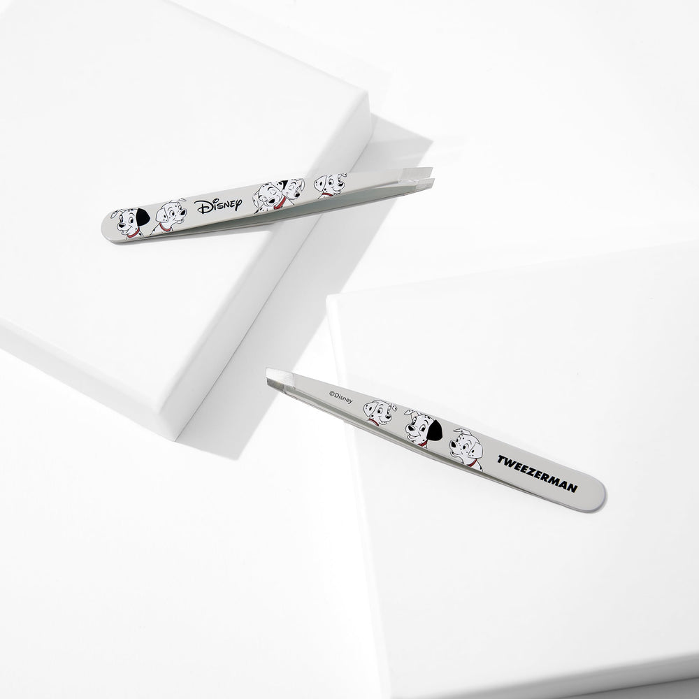 Tweezerman 101 Dalmatians tweezer in hand demonstrating precise control.