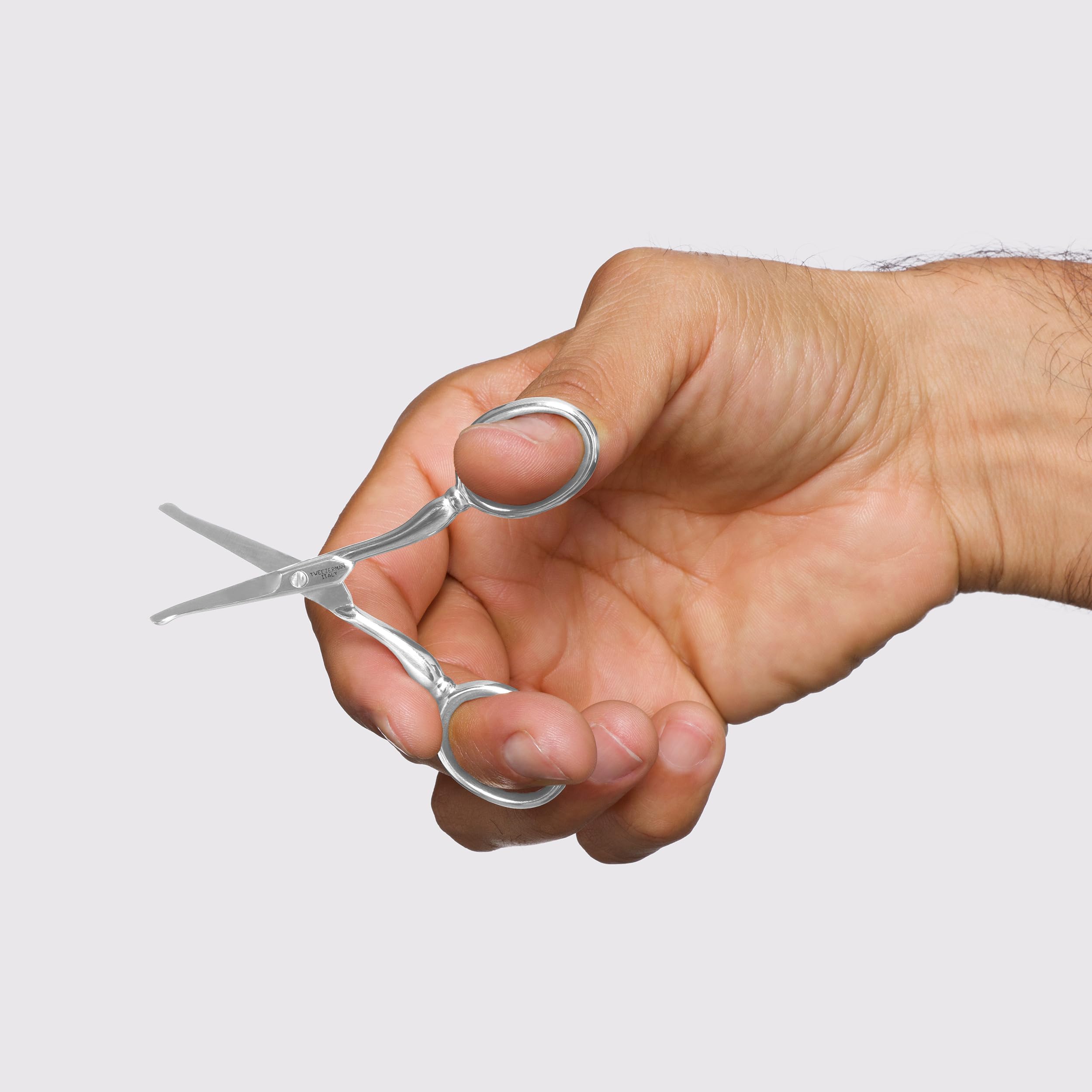 Tweezerman facial hair scissors ear-use close-up for safe ear hair trimming.
