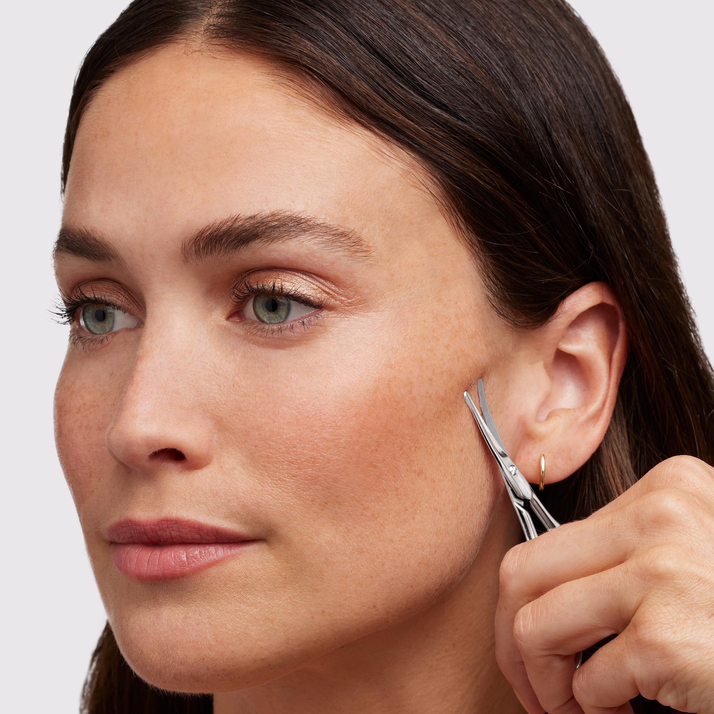 Tweezerman facial hair scissors nose-use close-up for careful nostril hair trimming.