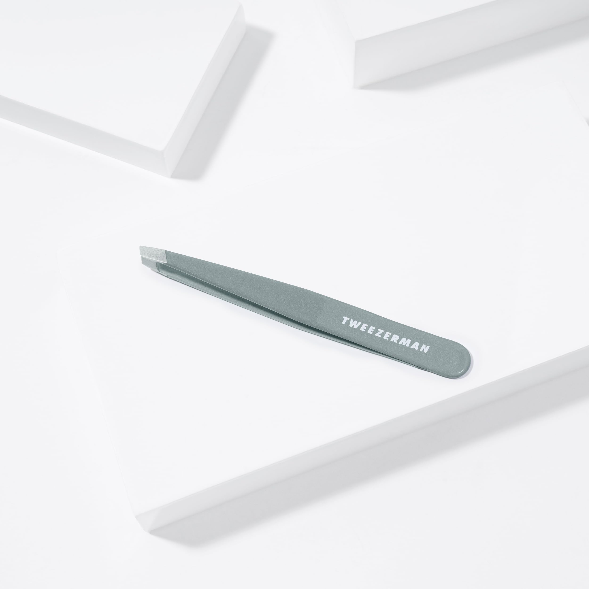 Tweezerman brow shaping use shows precise brow tidying with root level hair removal