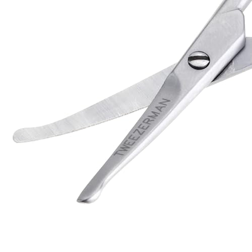 Ergonomic handles on Tweezerman G.E.A.R. scissors provide comfortable control.