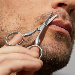 Rounded blade tip helps prevent nicks while trimming visible hair.