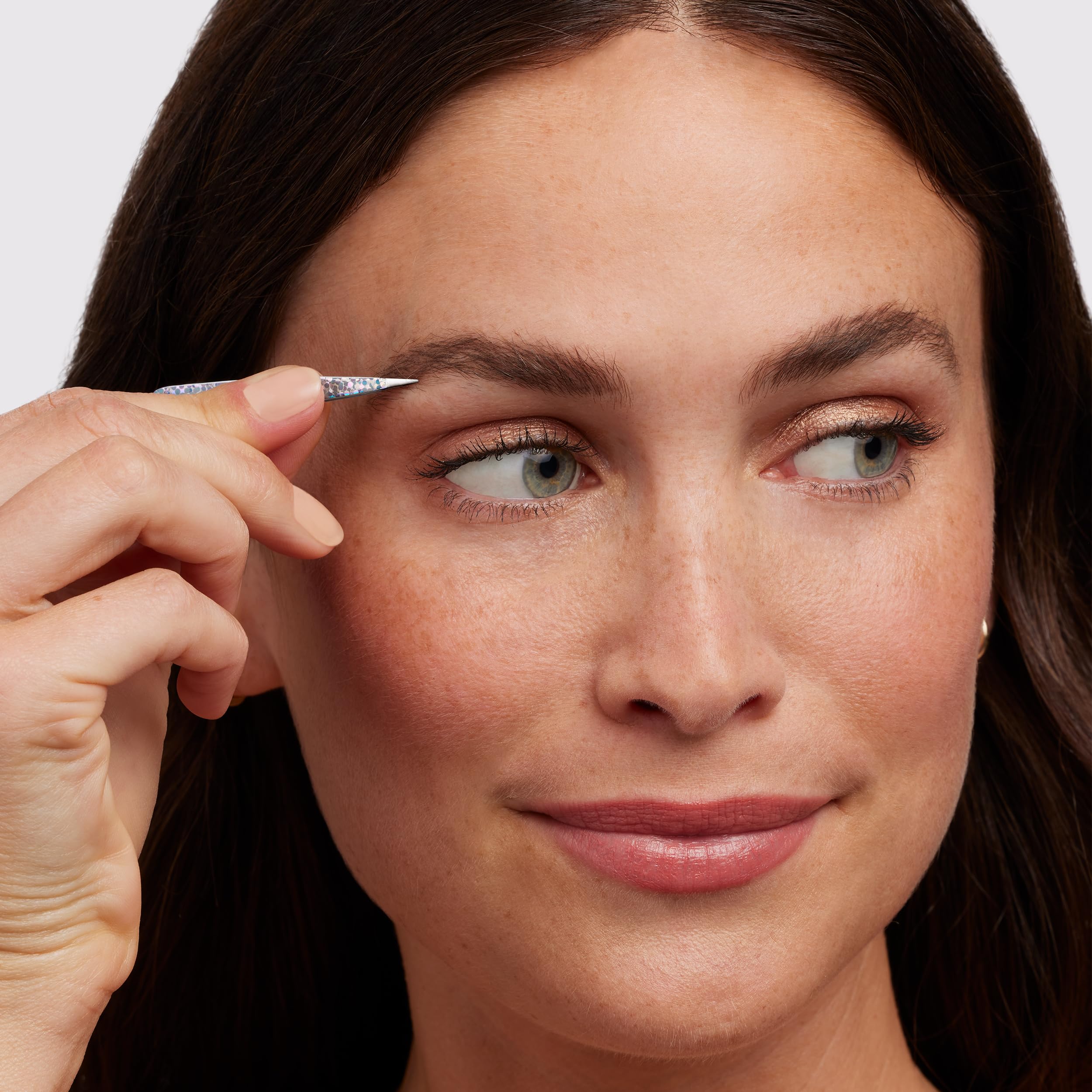 Slant tip targets brow hair above and below the shape
