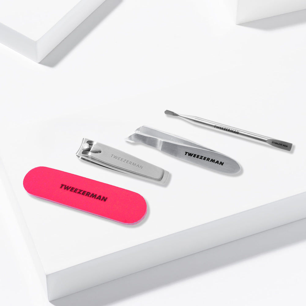 Tweezerman Mini Neon Nail Rescue Kit nail cleaner cleans under nails after trimming.
